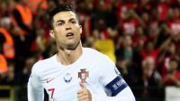 Kapten Portugal Cristiano Ronaldo merayakan golnya ke gawang Lithuania saat kualifikasi Piala Eropa 2020 di Vilnius. Petras Malukas / AFP
